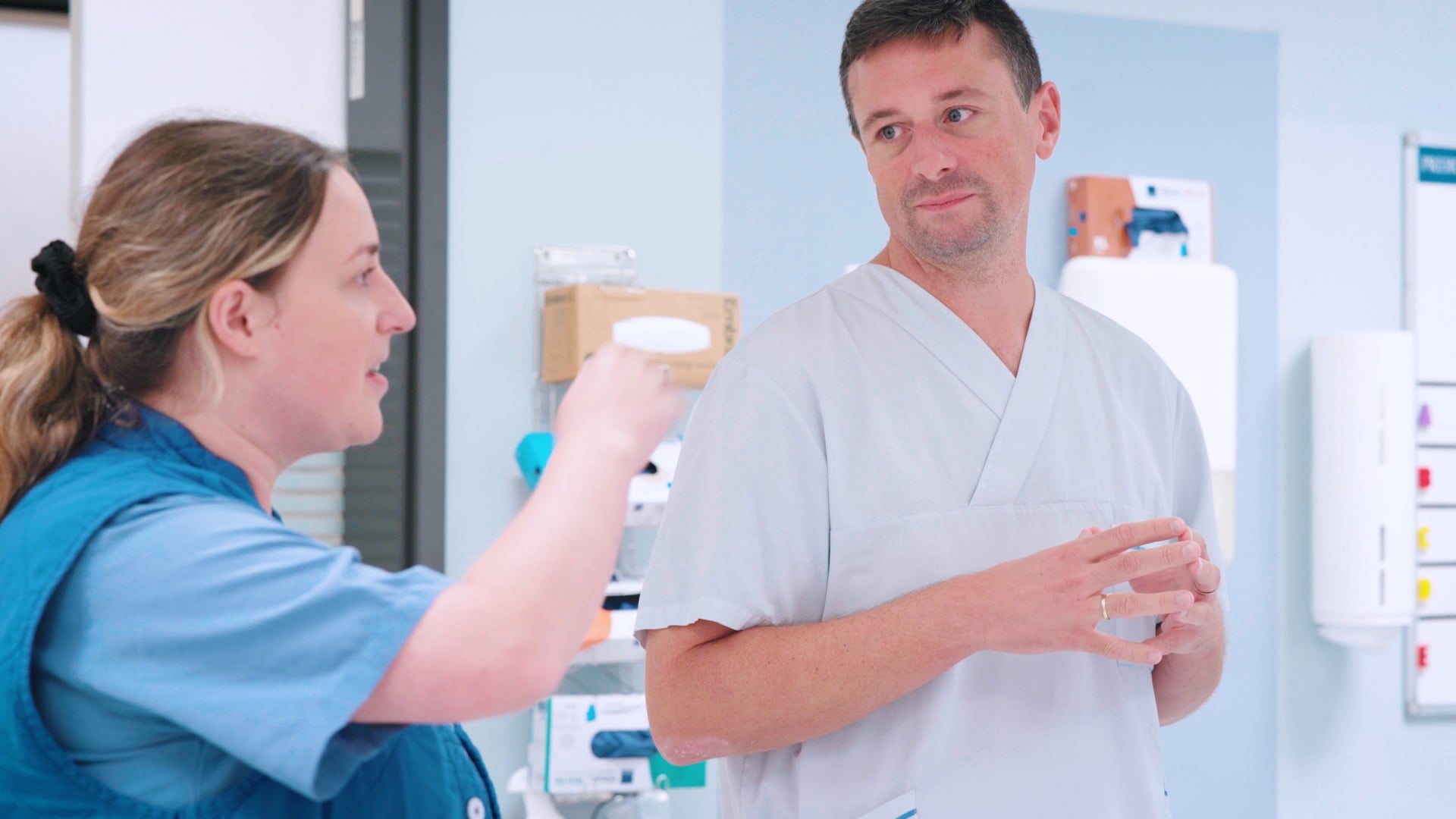 A man and a woman in a hospital room.