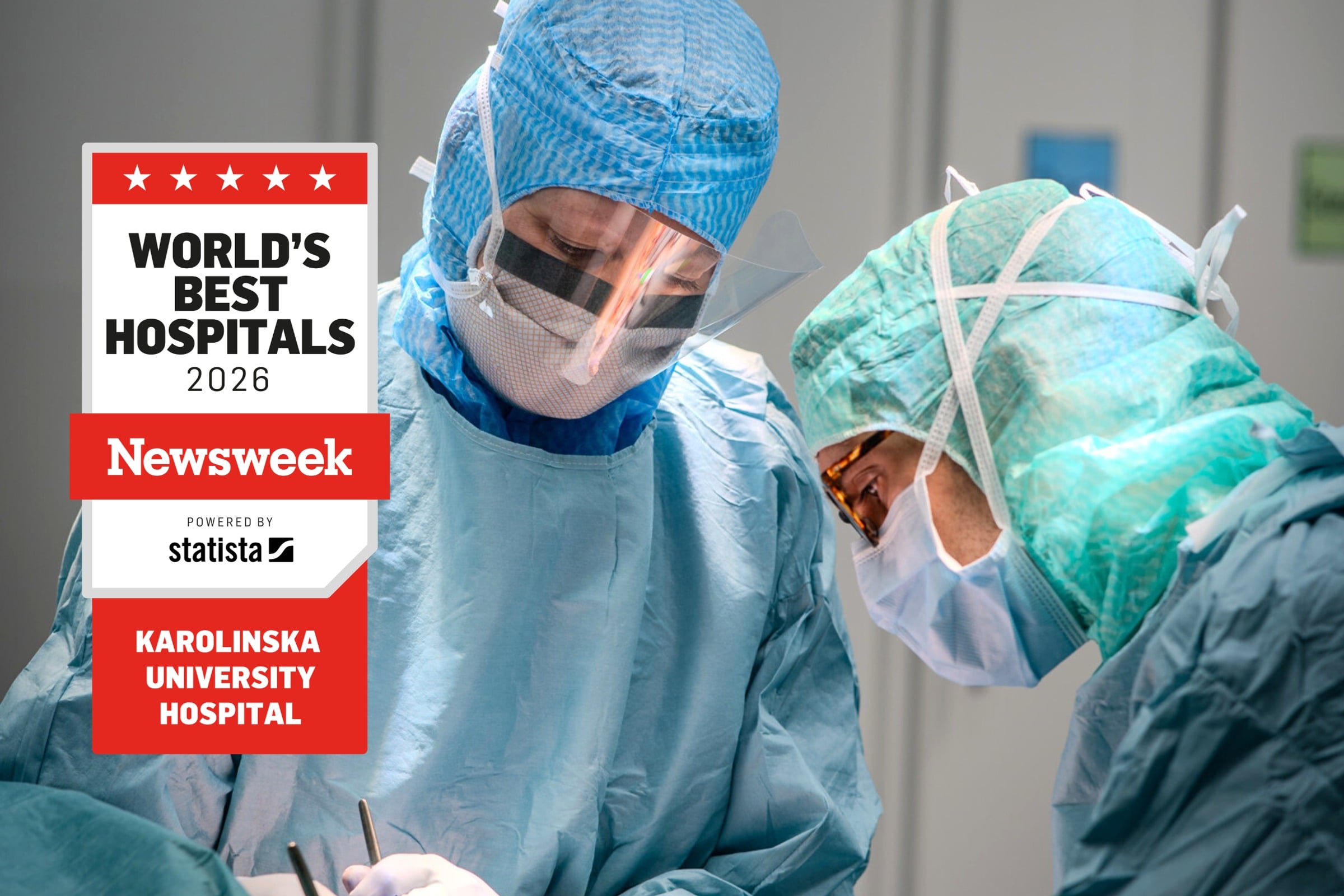 Two doctors in scrubs are performing surgery.